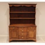A George III style golden oak dresser, in the manner of Titchmarsh and Goodwin, late 20th century,
