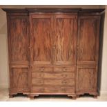 A large Chippendale revival mahogany breakfront wardrobe, early 20th century, the moulded dentil
