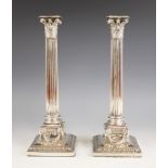 A pair of Edwardian silver candlesticks, Elkington & Co, Birmingham 1901, the weighted square