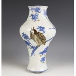 A Chinese porcelain vase, 19th century, the inverted baluster shaped vase decorated with an owl