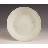 A Chinese Qingbai 'flower' dish, Song Dynasty, the circular dish with incised floral motifs enclosed