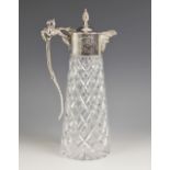 A silver mounted cut glass claret jug, B P Co, London 1969, of tapered cylindrical form with star