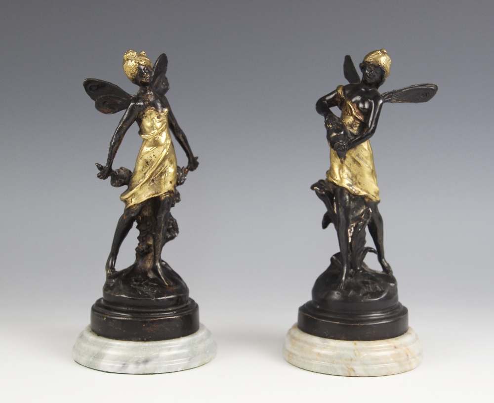 After Auguste Moreau (1834-1917), a pair of nymphs, each parcel gilt bronze patinated figure