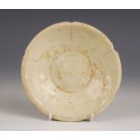 A Chinese porcelain Song Dynasty (960 -1279) bowl, the pale celadon glazed bowl of small lobed