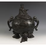 A Japanese bronze koro and cover, Meiji period (1868-1912), with dragon shaped handles and supported