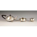 An Arts & Crafts three-piece silver tea service, Charles Edwards, Birmingham 1879, comprising