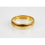 A George V 22ct gold wedding band, Kinsey Brothers & Patrick, Birmingham 1921, ring size N 1/2, 4.