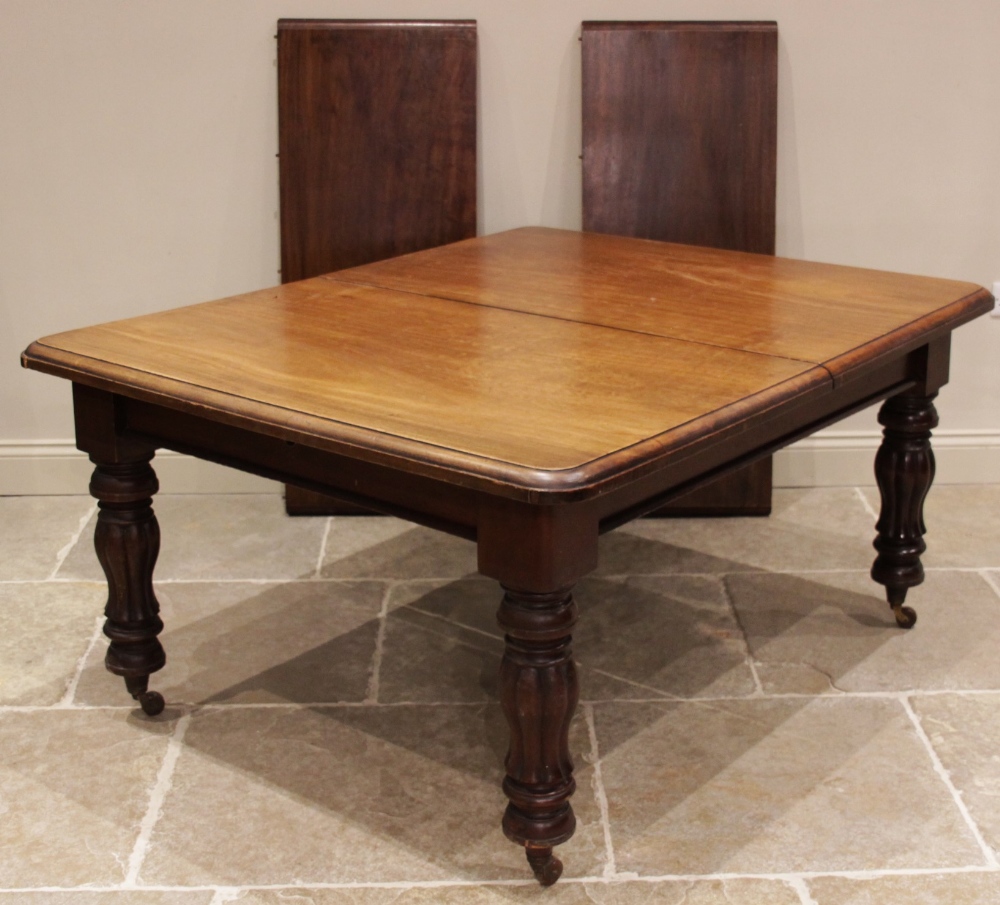 A Victorian mahogany extending dining table, the rectangular moulded top with rounded corners, - Image 2 of 4