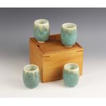 Peter Deck (Tasmanian, late 20th century), a set of four beakers, each of distorted ovoid form,