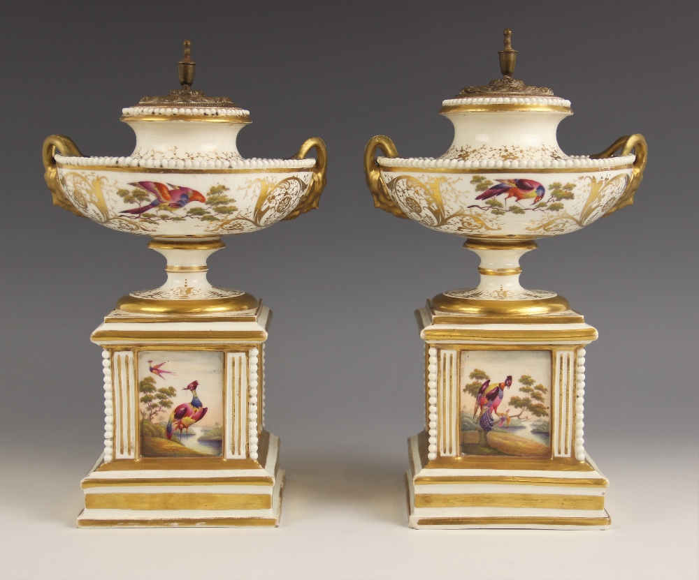 A pair of Paris porcelain pot pouri, 19th century, each modelled as a hemispherical urn on square