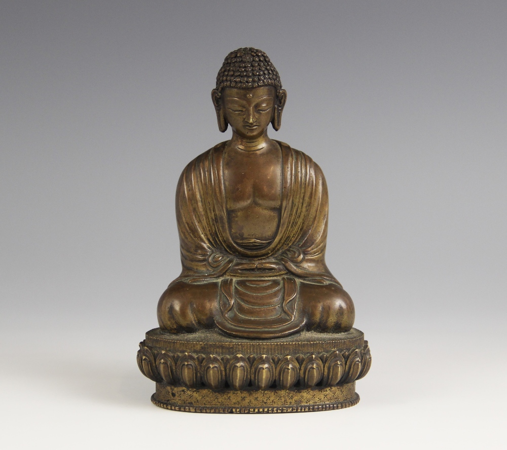 A bronze model of Buddha, possibly Sino-Tibetan, 18th/19th century, modelled seated in dhyanasana on