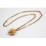 A George V 9ct gold heart-shaped locket pendant, W & F Rabone, Birmingham 1918, with scrolling