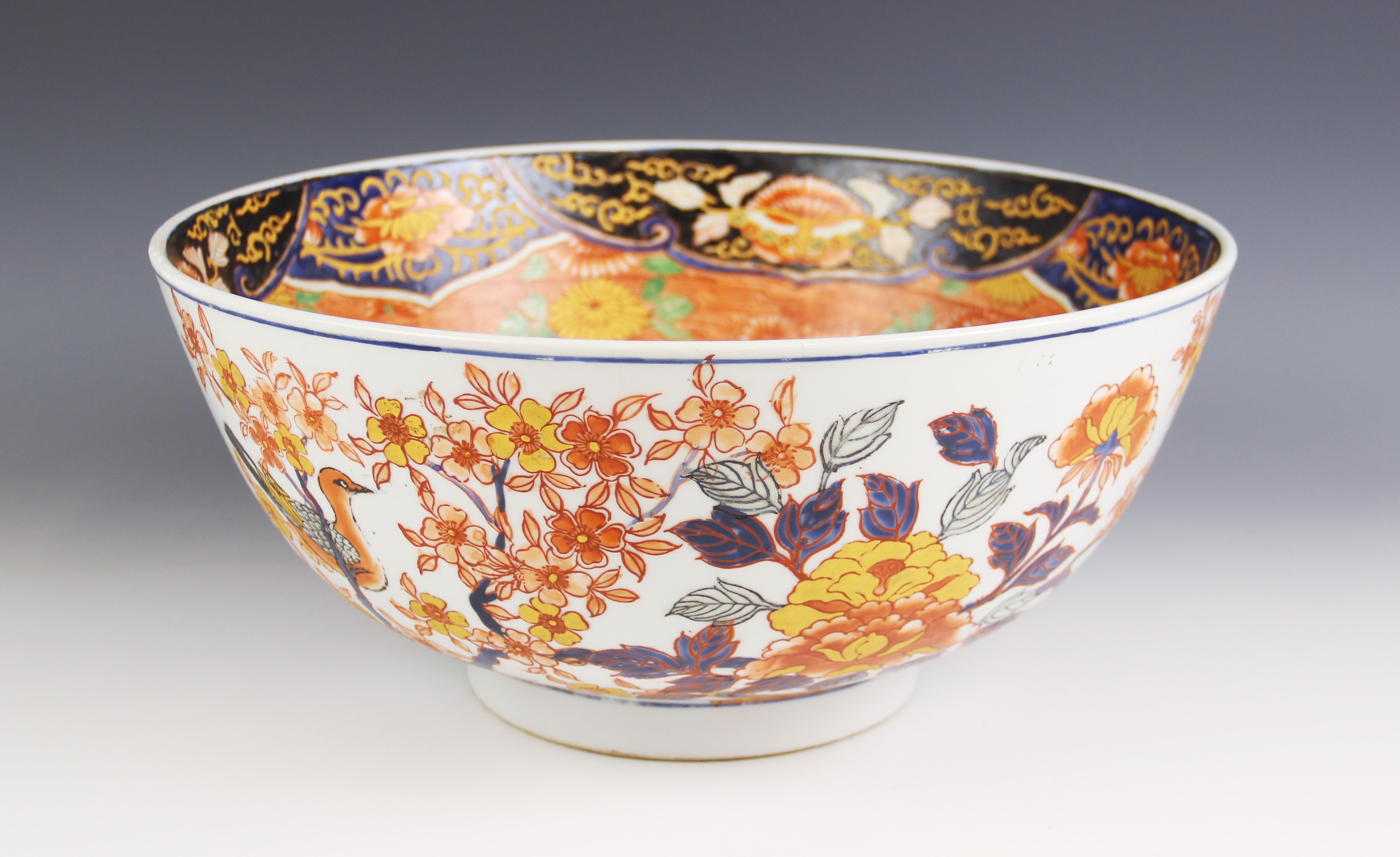 A large Japanese Imari porcelain punch bowl, Meiji Period (1868-1912), of circular form and