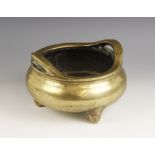 A large and substantial Chinese bronze censer, 19th century, of compressed circular form