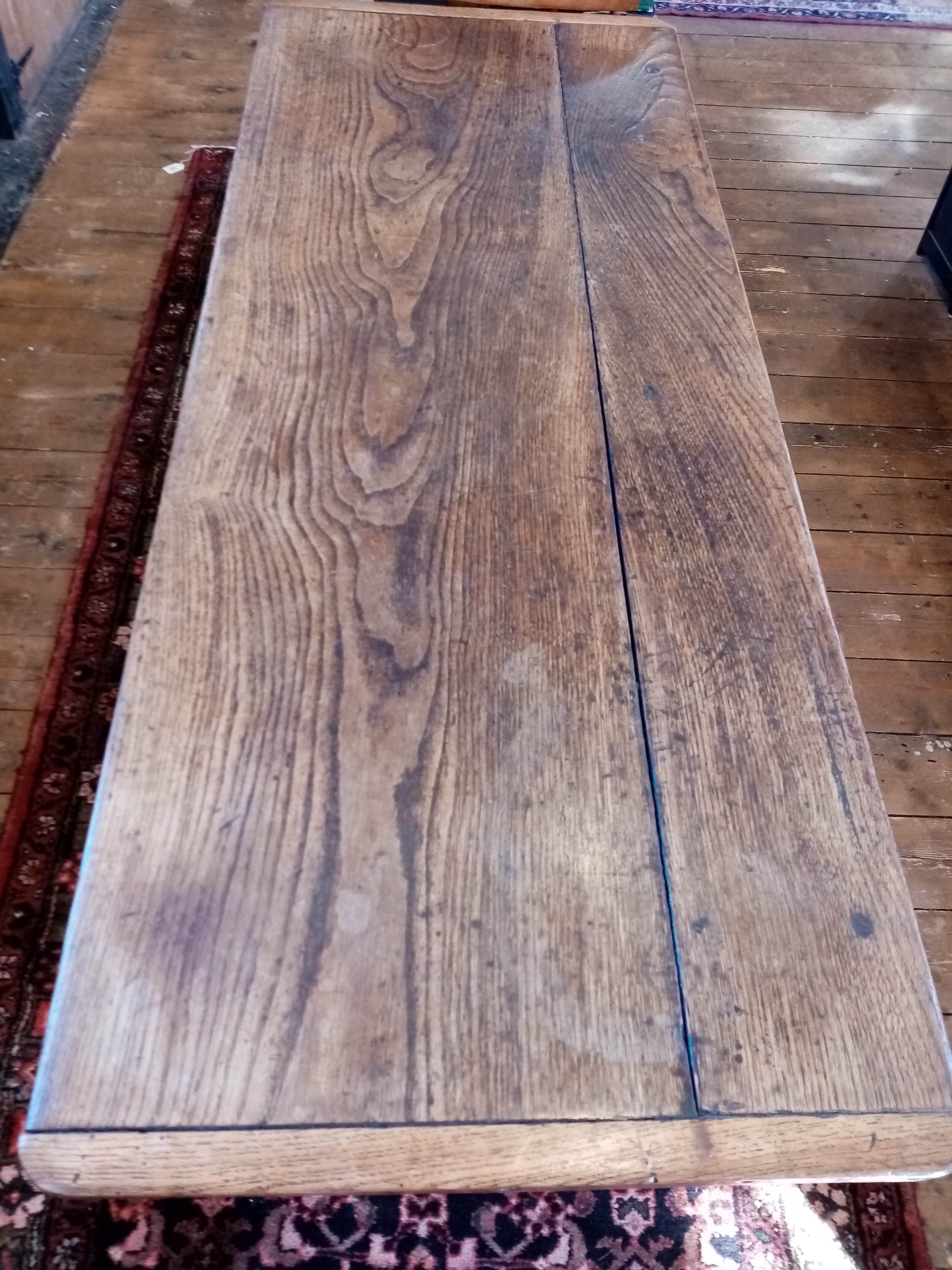 An elm plank top side table, probably French, early 19th century, the cleated top raised upon legs - Image 10 of 10