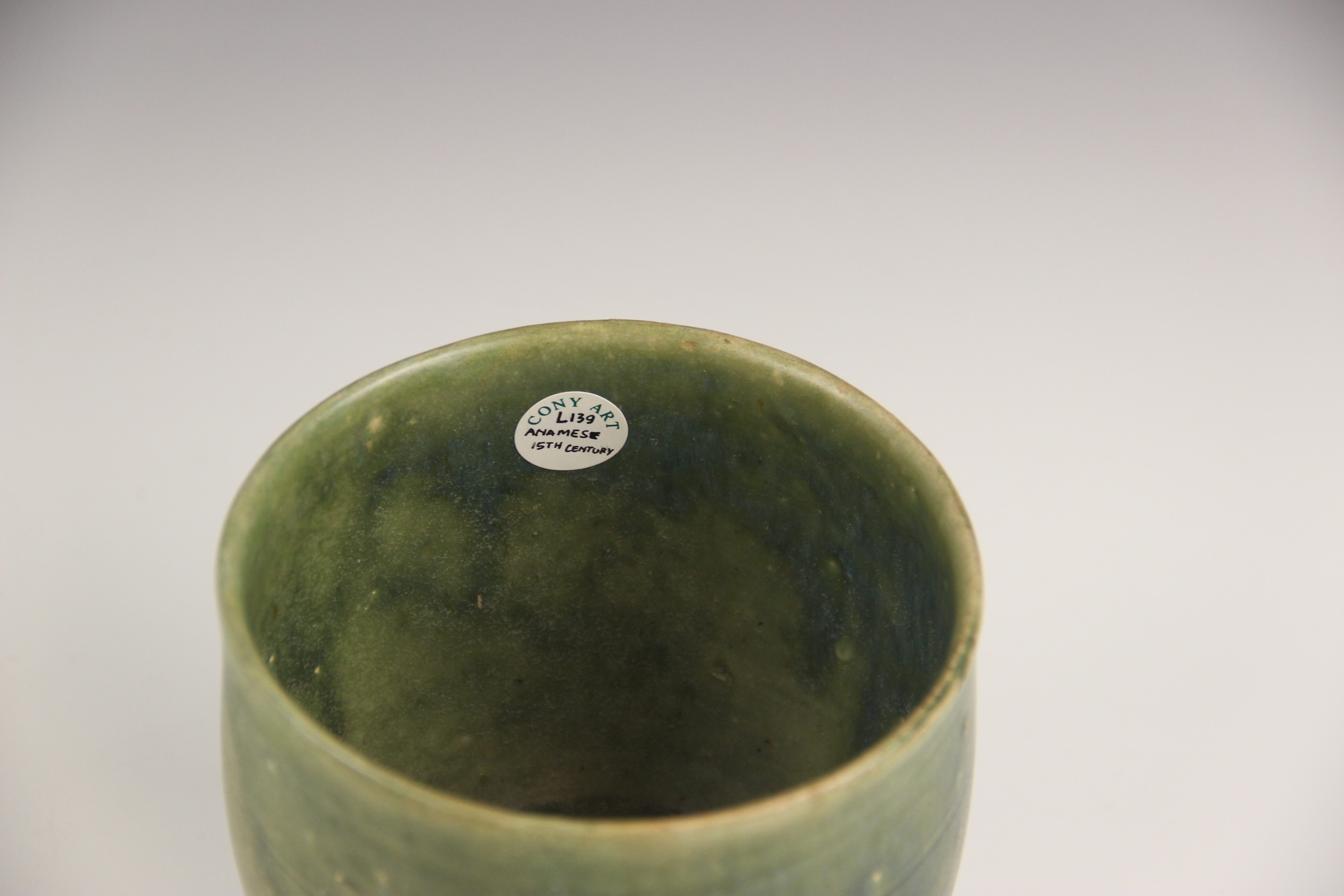 An Anamese pottery vessel, possibly 15th century, the cylindrical vase celadon glazed to the - Image 6 of 9