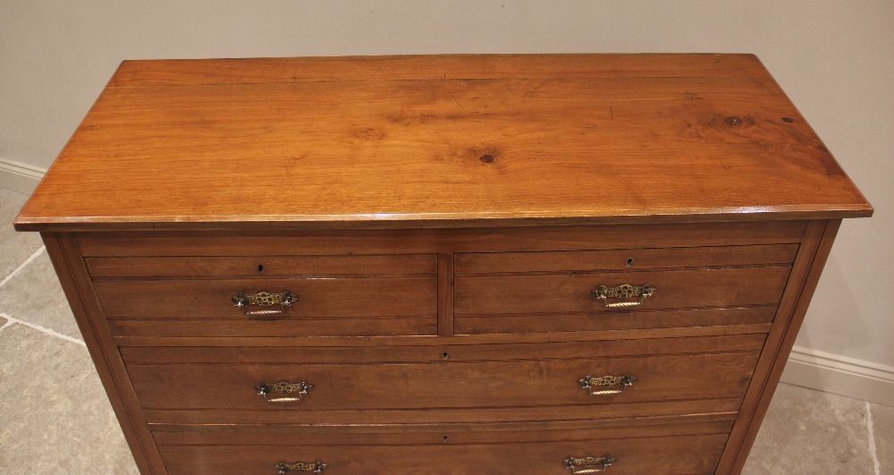 A late Victorian satin walnut chest of drawers, the rectangular moulded top above an arrangement - Image 2 of 2