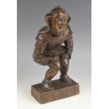 A 17th century style carved oak figure of Rigoletto, 20th century, modelled in jester attire upon an