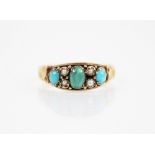 A Victorian turquoise and pearl ring, the central polished oval cabochon measuring 5.5mm x 3.8mm,