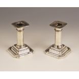 A pair of Edwardian silver mounted candlesticks, James Dixon & Sons Ltd, Sheffield 1905, the plain