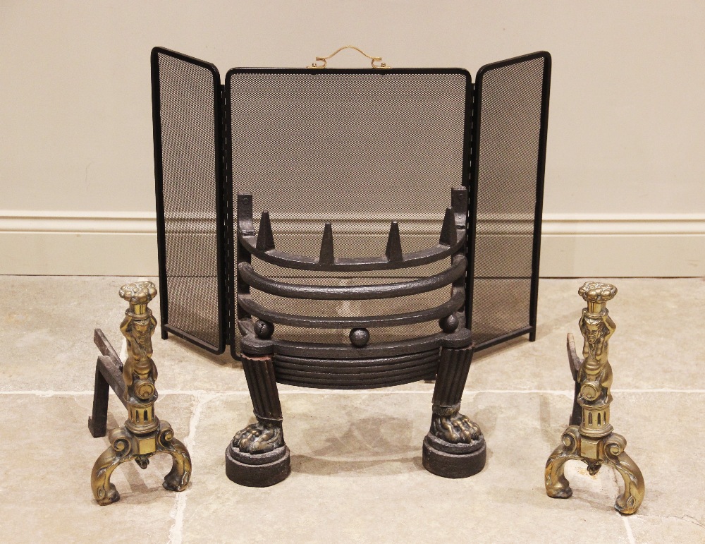 A 17th century style cast iron and brass fire front, 20th century, of railed bowfront form upon