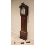 A George III 8 day longcase clock, signed indistinctly 'Scott Newcastle', the arched hood with a