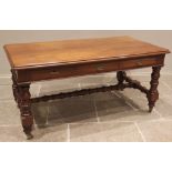 A late Victorian walnut library/writing table by Maple & Co, the rectangular thumb moulded top above