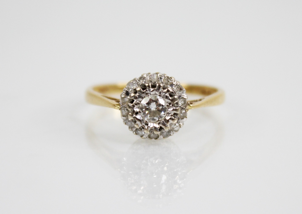 A diamond cluster 18ct gold ring, the central round brilliant cut diamond weighing approximately 0. - Image 5 of 5