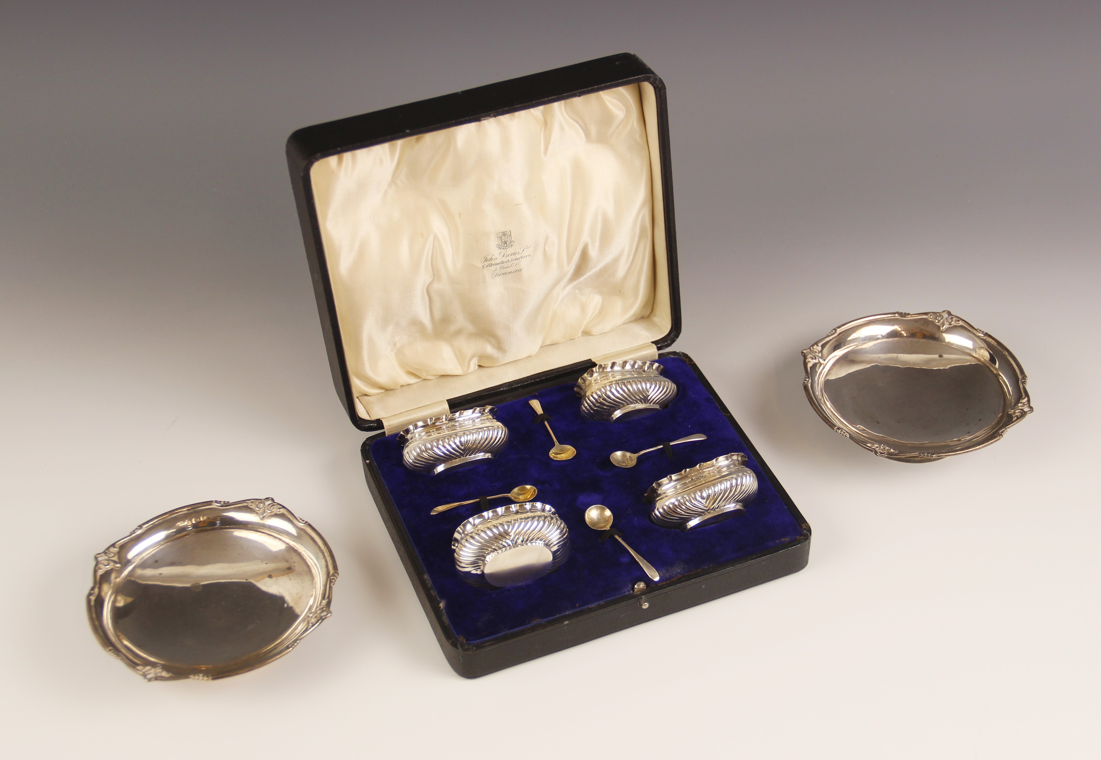 A cased set of four Victorian silver open salts, Henry Matthews, Birmingham 1897, each of compressed