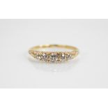 An Edwardian five stone diamond ring, the central old cut diamond measuring 3.8mm W x 2.43mm D, with