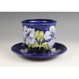 A Moorcroft cache pot in the Hibiscus pattern against a blue ground, mid to late 20th century,