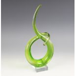 A Murano glass sculpture, of organic sinuous and interwoven form, upon a glass square section plinth