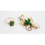 A 14ct gold floral spray brooch, designed as four polished navette shaped jade coloured stones, claw