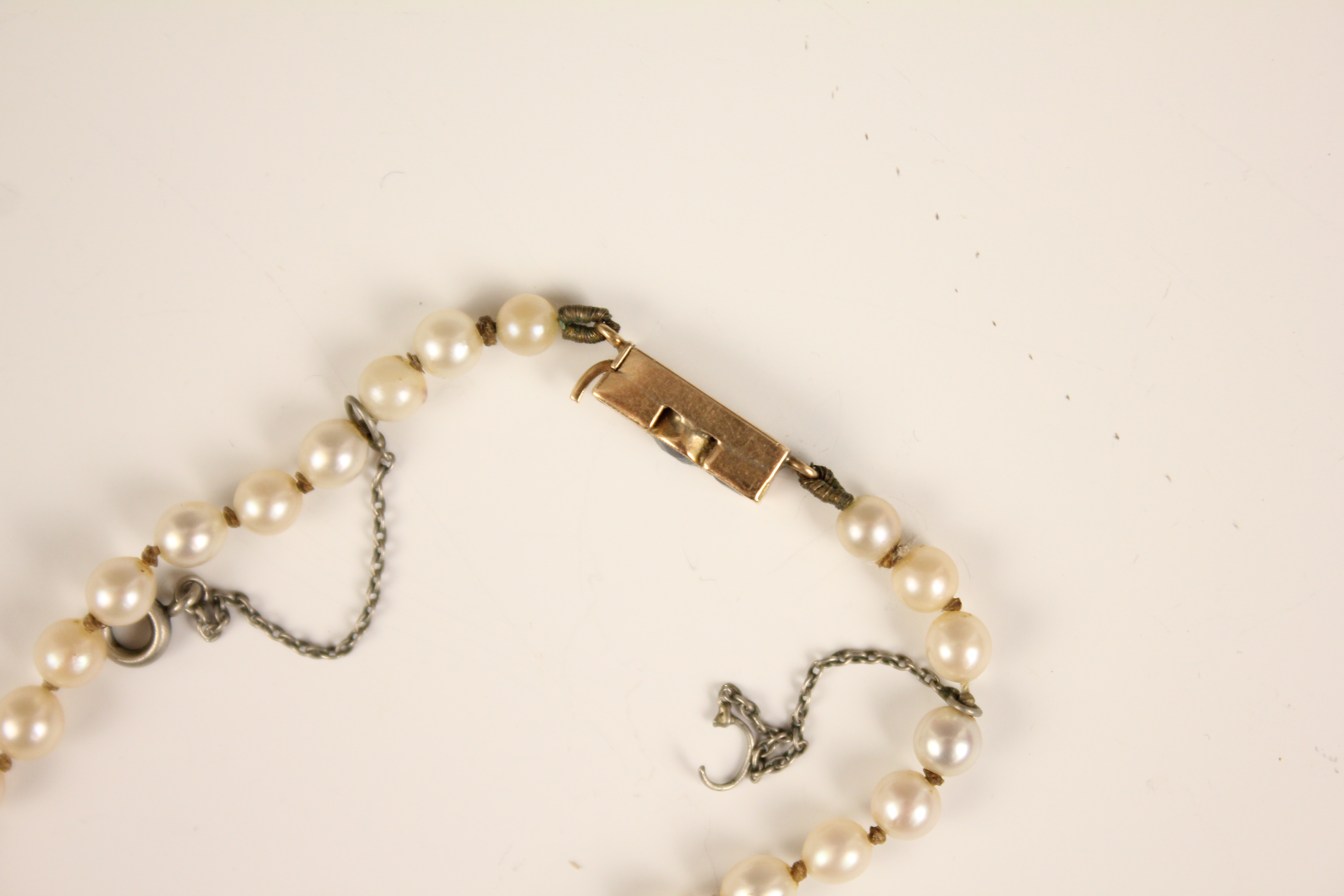 An early 20th century cultured pearl necklace, designed as a single row of round cultured pearls, - Image 12 of 12