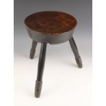 An Arts and Crafts rustic poker work 'Sit Ya Down' stool, possibly Scottish, the circular slab