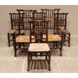 A matched set of twelve ash and elm rush seat spindle back chairs, 19th century, each with a