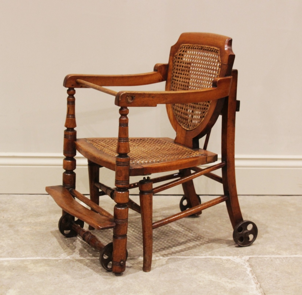 An Edwardian stained beech child's metamorphic high chair and walker with bergère shield shape - Image 2 of 5