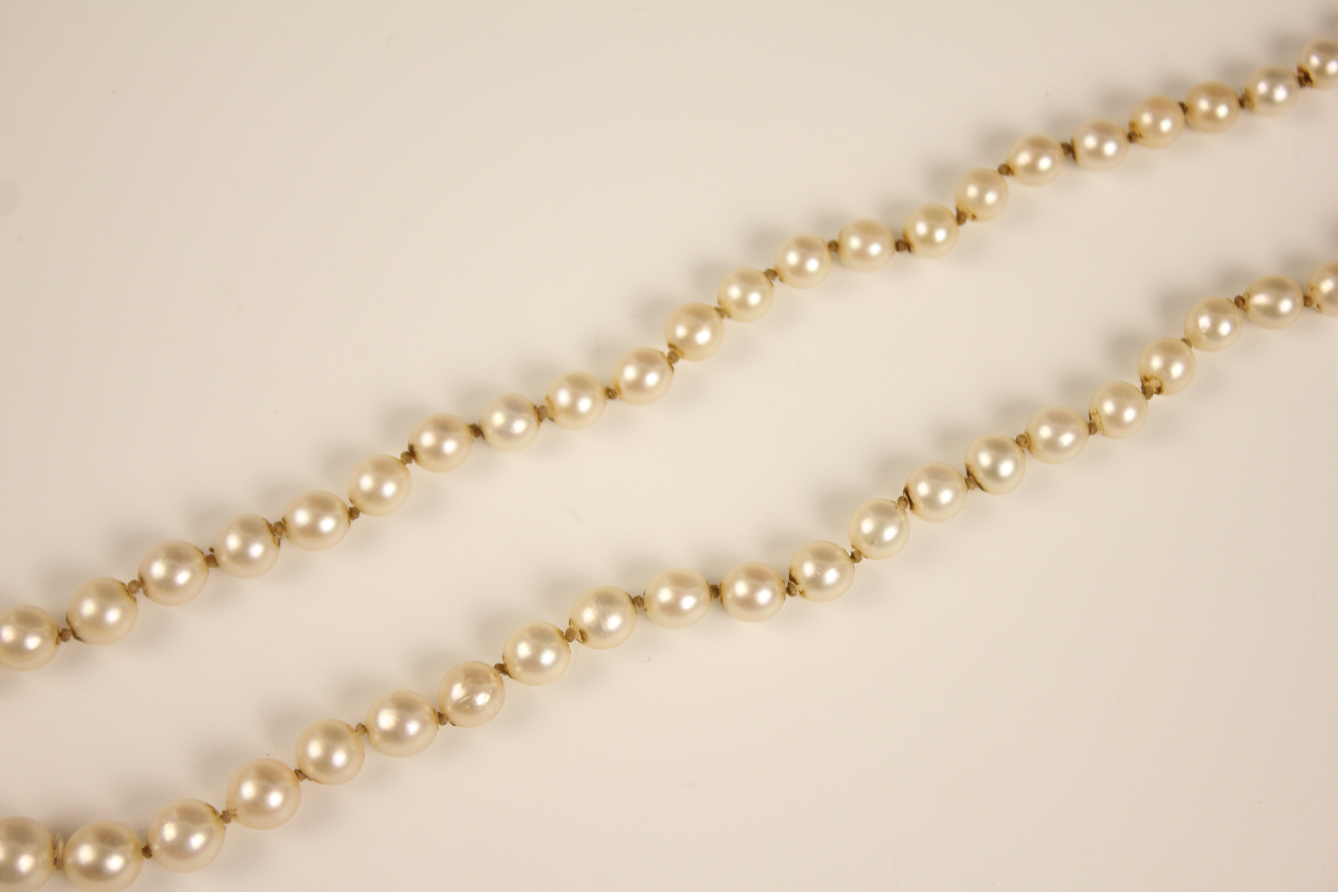 An early 20th century cultured pearl necklace, designed as a single row of round cultured pearls, - Image 7 of 12