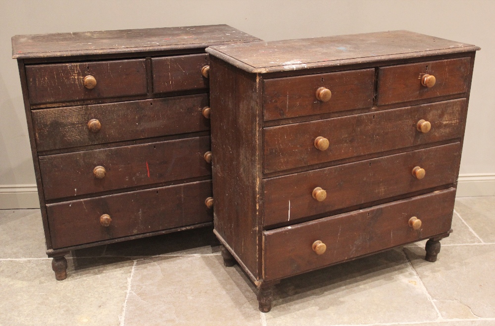 A pair of stained pine chests of drawers, 19th century, each with a rectangular moulded top over two