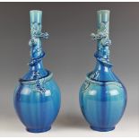 A pair of Japanese Awaji pottery bottle vases, Meiji period, the turquoise vases each with a three