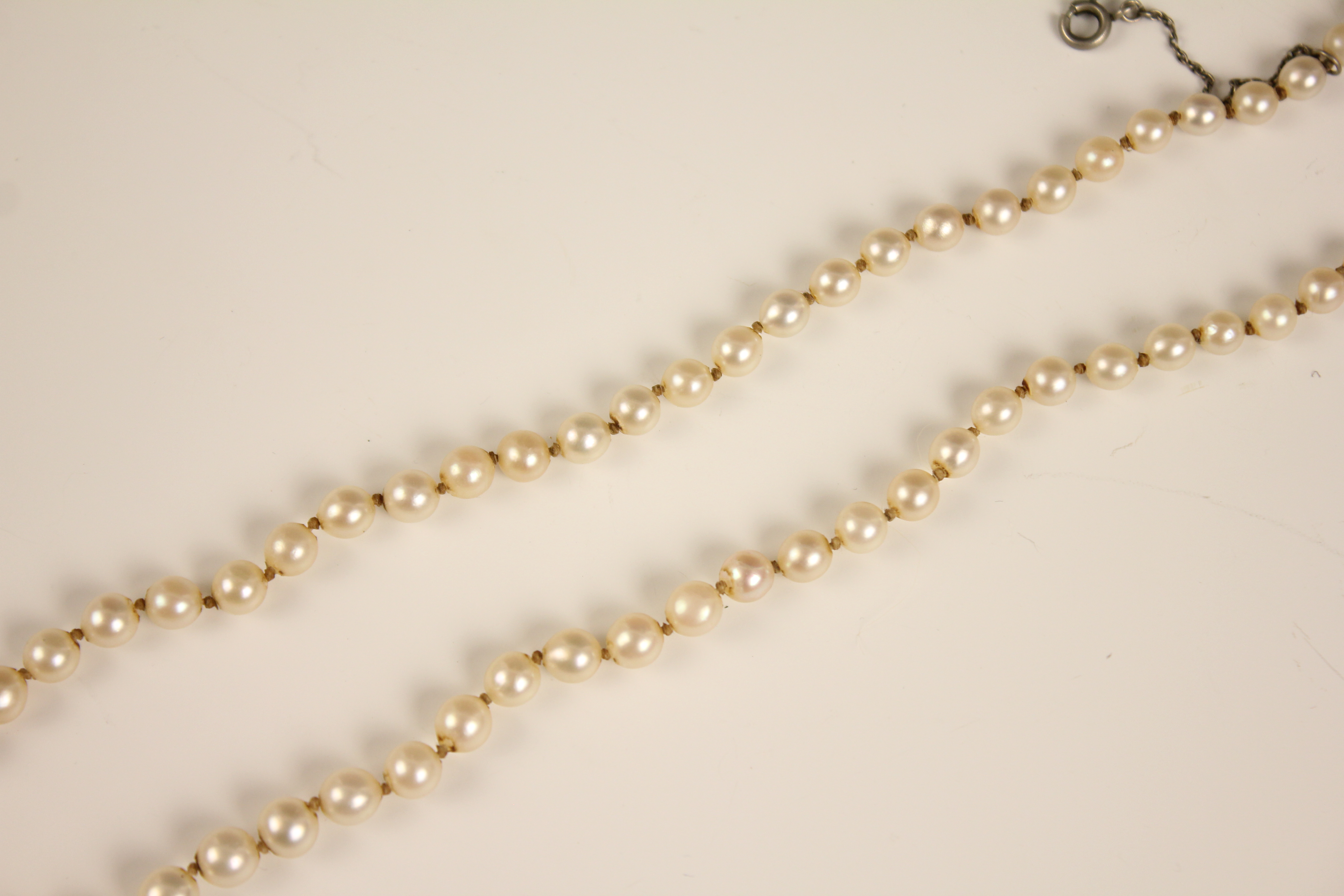 An early 20th century cultured pearl necklace, designed as a single row of round cultured pearls, - Image 8 of 12