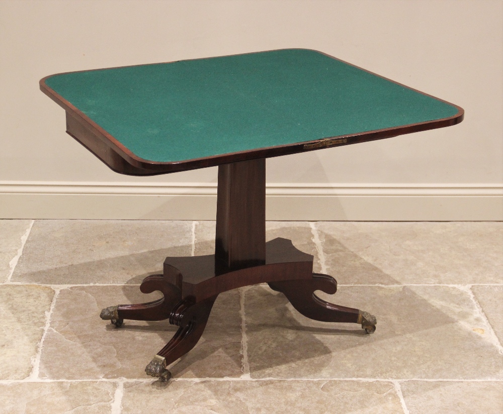 A George IV mahogany tea table, the quatreform pedestal raised upon four sabre supports, brass paw - Image 2 of 2