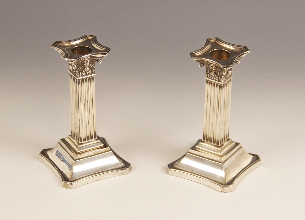 A pair of Victorian silver Corinthian column candlesticks, Martin, Hall & Co, Sheffield 1898, each