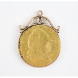 A George III spade guinea, set to a gold coloured pendant mount, weight 9.1gms