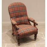 A Victorian mahogany open armchair, later upholstered in tartan fabric, the arched back extending to