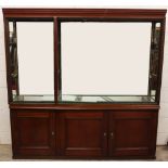 A late 19th/early 20th century and later stained wood museum display cabinet, the moulded cornice