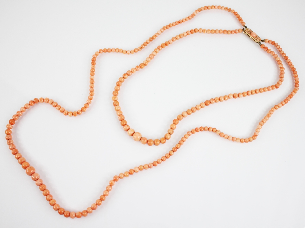 A Victorian coral necklace, designed as two rows of graduated coral beads, measuring between 4mm