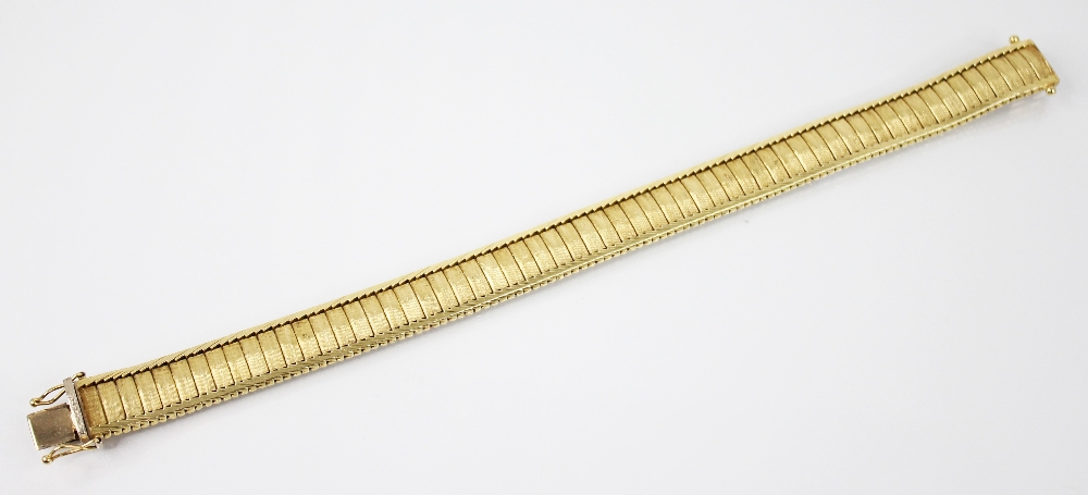 An 18ct gold continental bracelet, the rectangular link bracelet with textured finish, herringbone