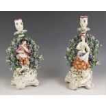 Two porcelain florally encrusted bocage figural candlestick figures, probably Derby late 18th