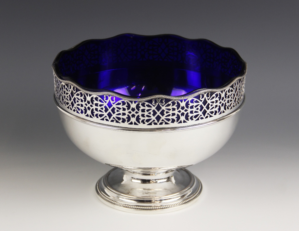 A silver plated fruit bowl, of circular form with pierced scrolling border and waved beaded rim,